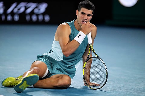 Australian Open 2025: Carlos Alcaraz reacts following a fall during match against Novak Djokovic