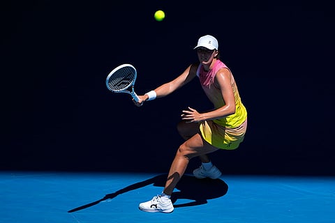 Australian Open 2025: Iga Swiatek plays a forehand return to Emma Navarro
