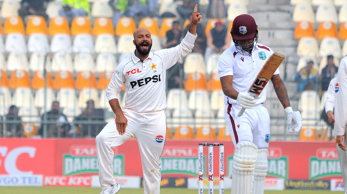 AP Photo/Asim Tanveer                 : Pakistan's Sajid Khan, left, celebrates after taking the wicket of West Indies Keacy Carty right, during day three of the first test cricket match between Pakistan and West Indies, in Multan.