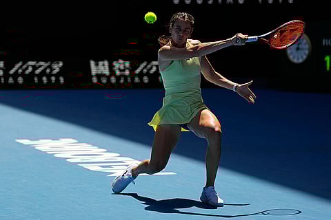 Australian Open 2025: Emma Navarro plays a backhand return to Iga Swiatek