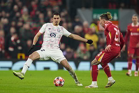 Champions League 2024–25: Kostas Tsimikas challenges for the ball with Aissa Mandi