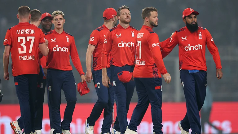 Buttler and his team-mates look on during the first T20I - null