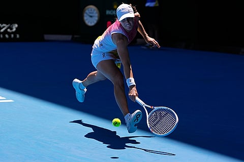 Australian Open 2025: Iga Swiatek plays a backhand return to Emma Navarro