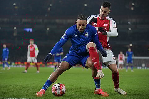 Champions League 2024-25: Dinamo's Samy Mmaee is challenged by Arsenal's Gabriel Martinelli