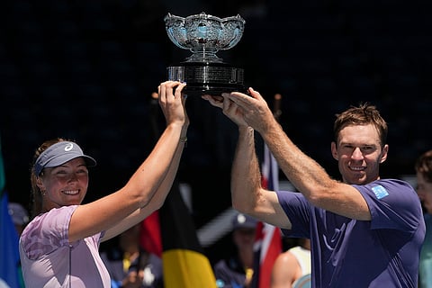 Olivia Gadecki and John Peers of Australia hold their trophy aloft after defeating compatriots Kimberly Birrell and John-Patrick Smith in the mixed doubles final at the Australian Open