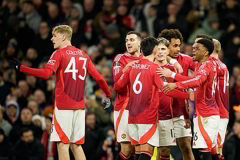 Europa League 2024-25: Manchester United's players celebrate after Rangers' goalkeeper Jack Butland scored an own goal