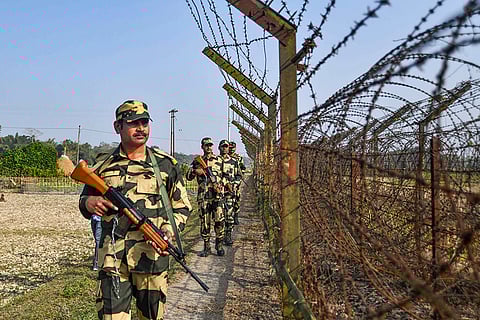 BSF personnel patrol along the India-Bangladesh border