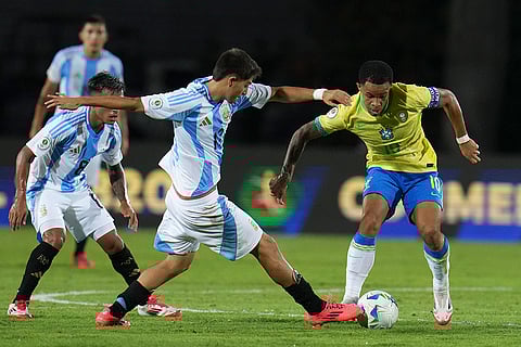 U-20 South American Championship: Argentina's Agustin Chavez and Brazil's Pedro Silva, right, fight for the ball 