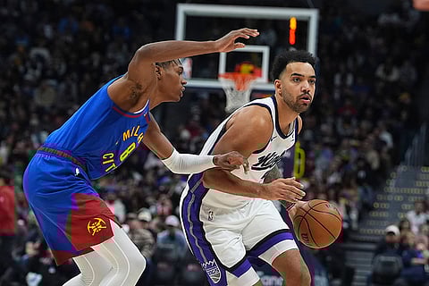 NBA Basketball 2024-25: ings forward Trey Lyles drives past Nuggets forward Peyton Watson,