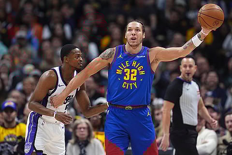 NBA Basketball 2024-25: Nuggets forward Aaron Gordon fields a pass as Kings De'Aaron Fox defends