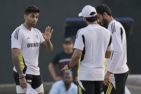 IND vs ENG 2nd T20: Surya Kumar Yadav, left, gestures with teammates during practice session