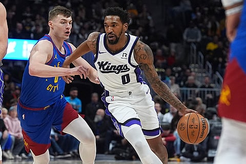 NBA Basketball 2024-25: Kings guard Malik Monk drives past Nuggets guard Christian Braun