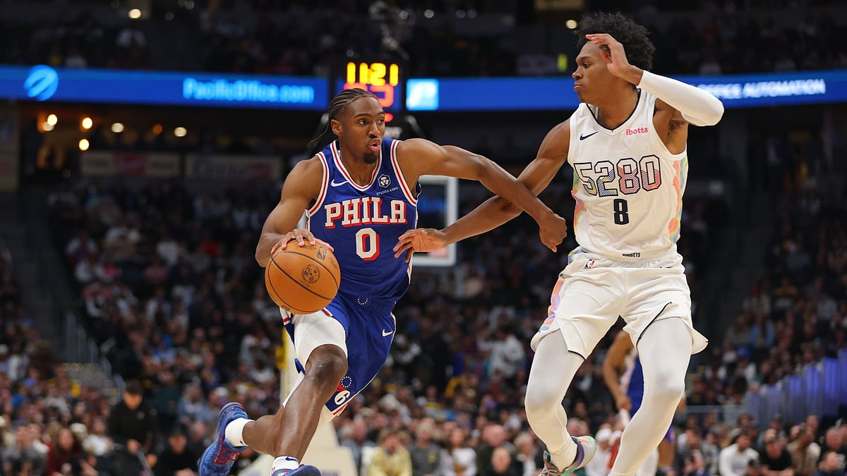 Tyrese Maxey takes on Peyton Watson.