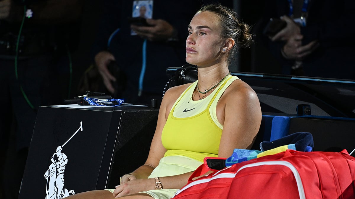 Aryna Sabalenka sits at courtside after losing to Madison Keys.