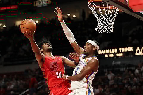 NBA 2024-25: Trail Blazers guard Scoot Henderson (00) drives to the basket