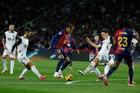 La Liga 2024-25: Barcelona's Lamine Yamal and Valencia's Pepelu challenge for the ball