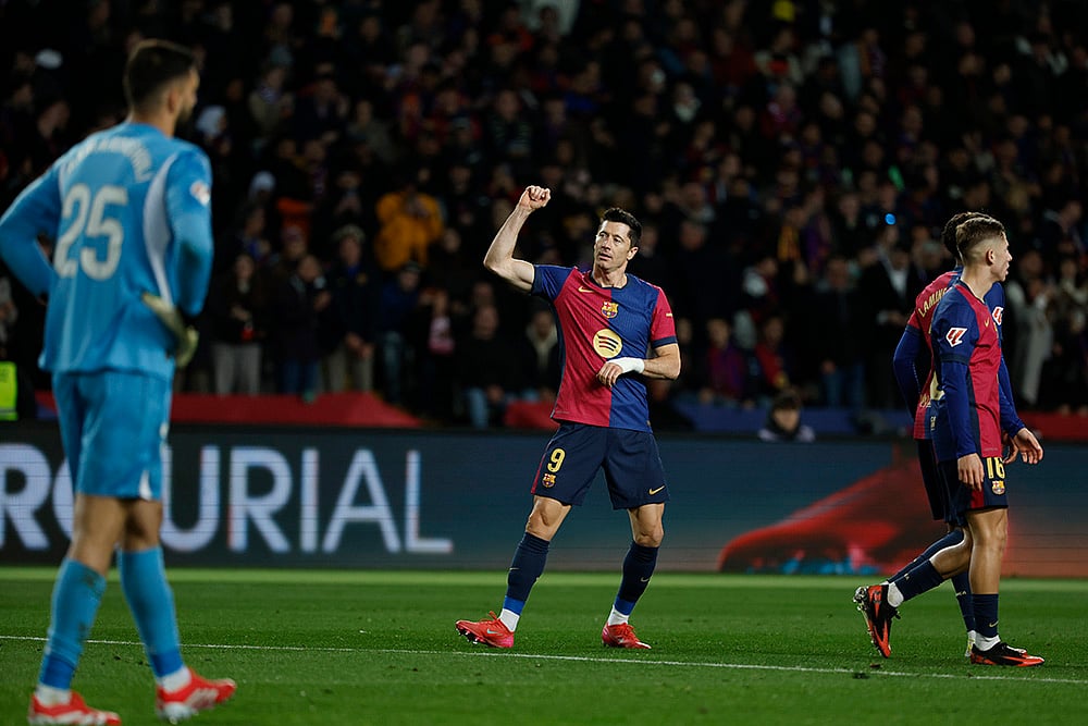 | Photo: AP/Joan Monfort : La Liga 2024-25: Robert Lewandowski celebrates after scoring his side's sixth goal 