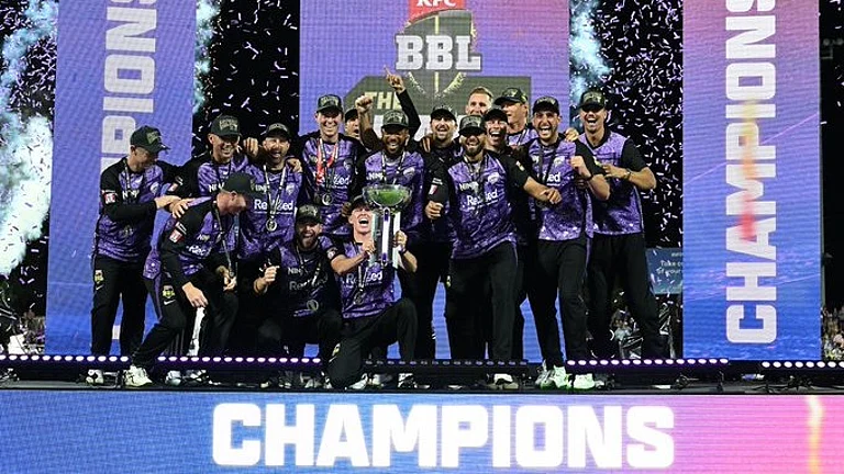 Hobart Hurricanes celebrate with the BBL trophy. - X/BBL