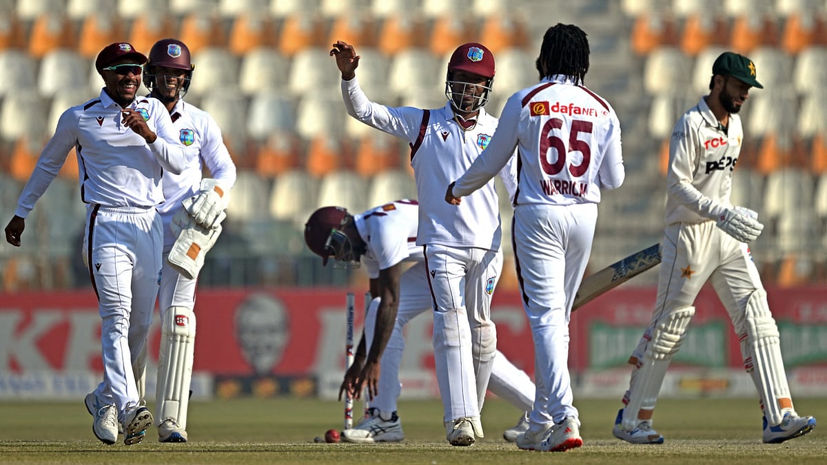 West Indies celebrate the dismissal of Kashif Ali - null