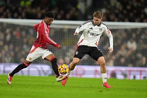 EPL 2024-25: Manchester United's Amad Diallo and Fulham's Emile Smith Rowe compete for the ball
