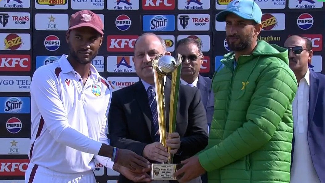 Screengrab : Pakistan skipper Shan Masood with his West Indian counterpart Kraigg Braithwaite pose with the trophy.