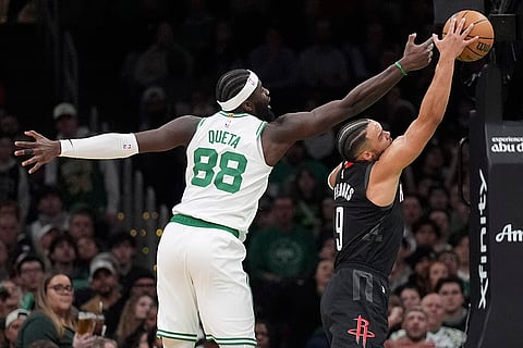 NBA 2024-25: Celtics center Neemias Queta (88) tries to grab a rebound against Rockets forward Dillon Brooks