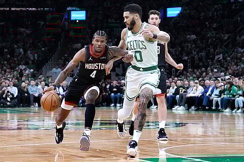 NBA 2024-25: Rockets guard Jalen Green (4) drives to the basket against Celtics forward Jayson Tatum