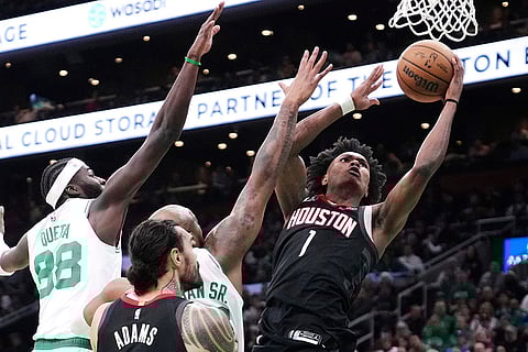 NBA 2024-25: Rockets forward Amen Thompson (1) drives to the basket against the Celtics
