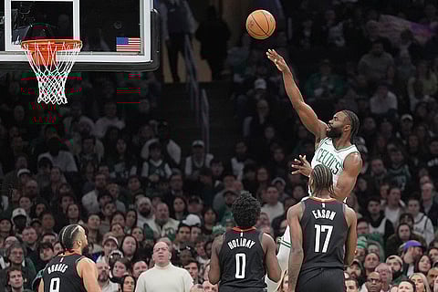 NBA 2024-25: Celtics guard Jaylen Brown shoots over the Rockets