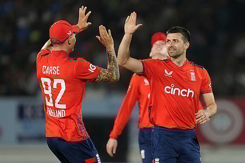 IND vs ENG 3rd T20: England's Mark Wood, right, celebrates the wicket of Suryakumar Yadav
