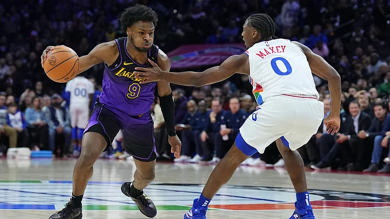 Bronny James and Tyrese Maxey. - null