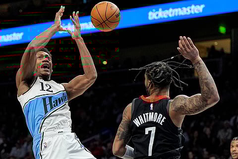 NBA 2024-25: Hawks forward De'Andre Hunter (12) shoots against Rockets Cam Whitmore