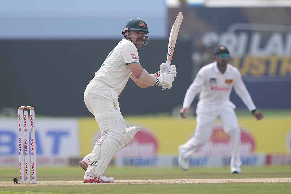 | Photo: AP/Eranga Jayawardena : SL vs AUS 1st Test Day 1: Australia's Travis Head plays a shot