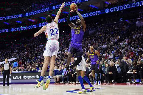 NBA 2024-25: Lakers' LeBron James (23) goes up for a shot against 76ers' Pete Nance