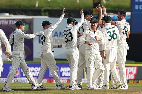 SL vs AUS 1st Test Day 2: Australia's Mitchell Starc celebrates the wicket of Sri Lanka's Dimuth Karunaratne