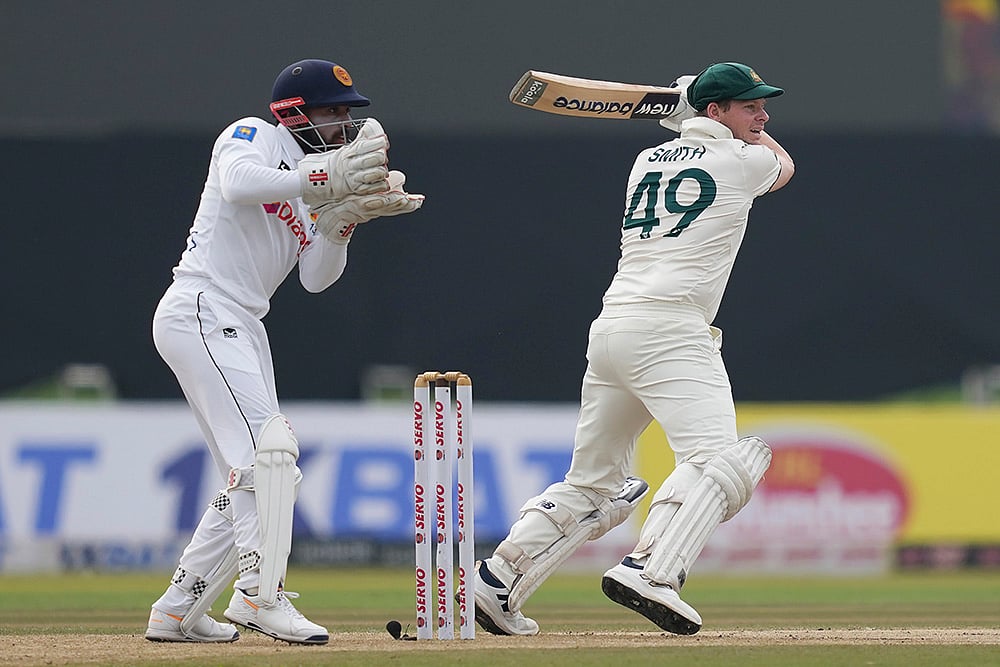 | Photo: AP/Eranga Jayawardena : SL vs AUS 1st Test Day 2: Australia's Steven Smith plays a shot 