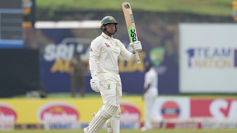 | Photo: AP/Eranga Jayawardena : SL vs AUS, 1st Test Day 2: Usman Khawaja celebrates his hundred and fifty runs.
