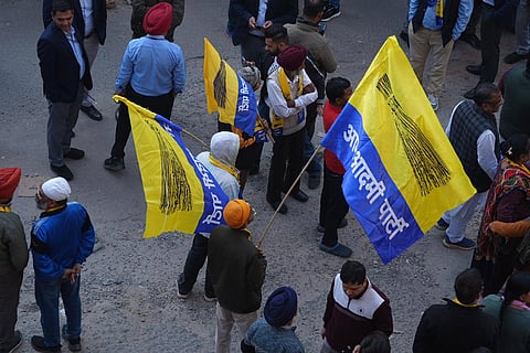 AAP supporters during a roadshow in Rajouri Garden