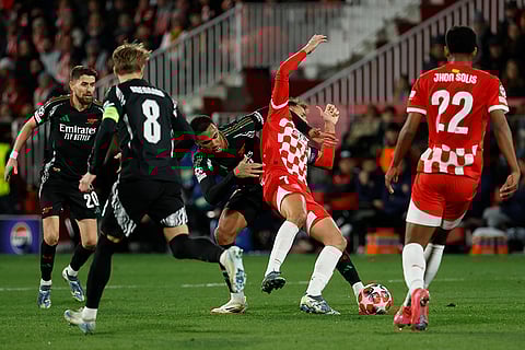 Champions League 2024-25: Girona's Cristhian Stuani is challenged by Arsenal's Gabriel