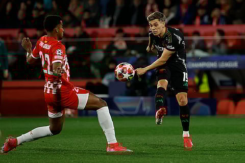 Champions League 2024-25: Arsenal's Leandro Trossard is challenged by Girona's Jhon Solis