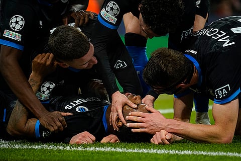 Champions League 2024-25: Brugge's Raphael Onyedika celebrates with teammates after scoring a goal