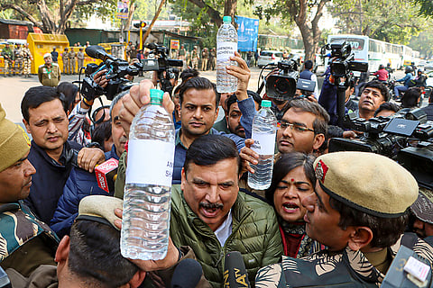 Sanjay Singh carries Yamuna water samples to BJP HQ