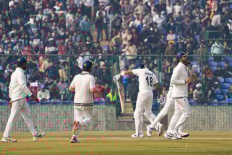 Ranji Trophy, Delhi vs Railways-Day 2: Railways' players celebrate the wicket of Delhi's Virat Kohli