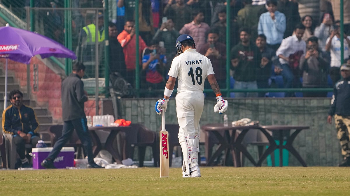 PTI/Atul Yadav : Virat Kohli returns to pavilion after being dismissed by Railways' Himanshu Sangwan on the second day of a Ranji trophy cricket match.