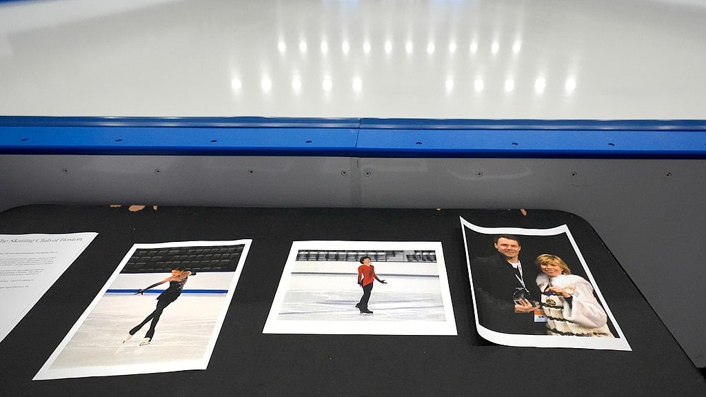 AP : Photographs of aircraft crash victims from The Skating Club of Boston rink are displayed rink side, Thursday, Jan. 30, 2025, in Norwood, Mass. From left is skater Jinna Han, skater Spencer Lane and coaches Vadim Naumov and Evgenia Shishkova.
