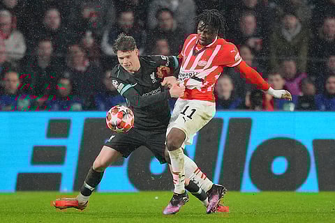 Champions League 2024-25: Liverpool's James McConnell and PSV's Johan Bakayoko fight for the ball
