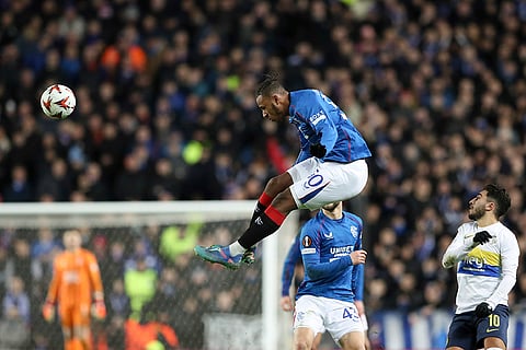 Europa League 2024-25: Rangers' Zakariya Lovelace, top, jumps for the ball