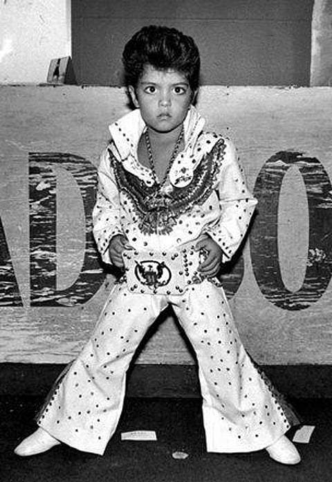 Bruno Mars as Little Elvis in family band