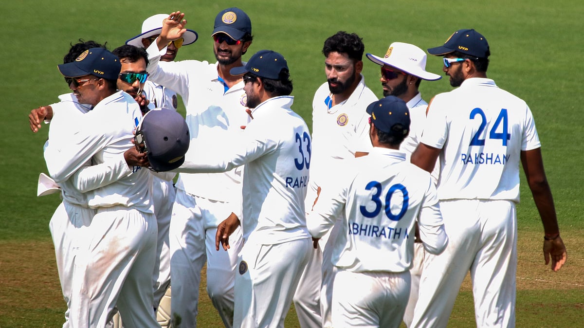 Photo: PTI : Hyderabad's Mohammed Siraj celebrates with teammates after taking wicket of Vidarbha batter Yash Rathod on Day 3 of Ranji Trophy, round 7.