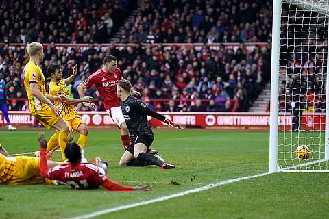 English Premier League: Nottingham Forest's Chris Wood, second left, scores a goal